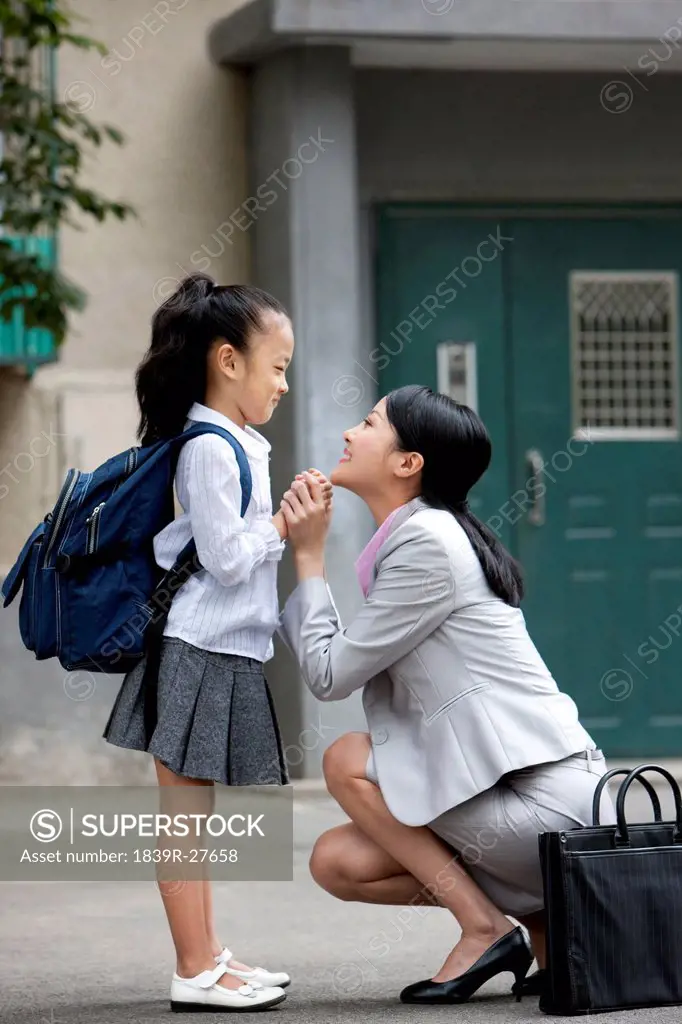 Chinese mother and daughter getting ready for scool