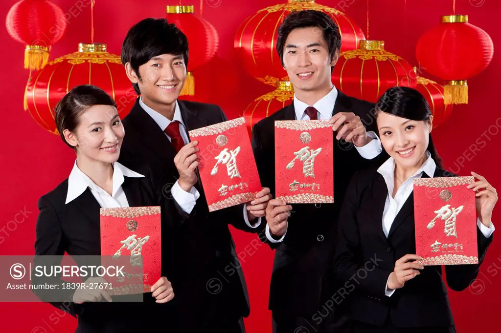 Business Team Holding Red Envelopes