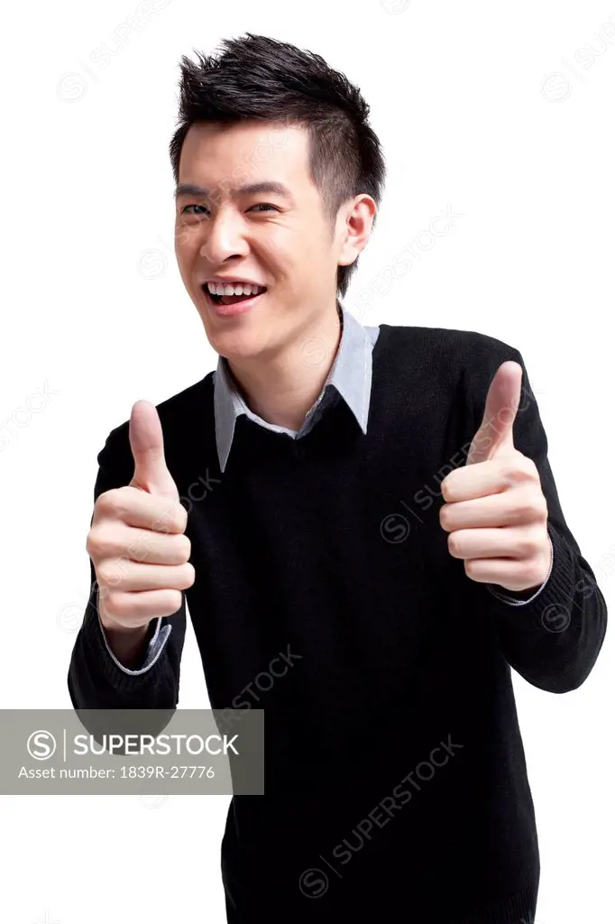 Stylish young man showing thumbs_up