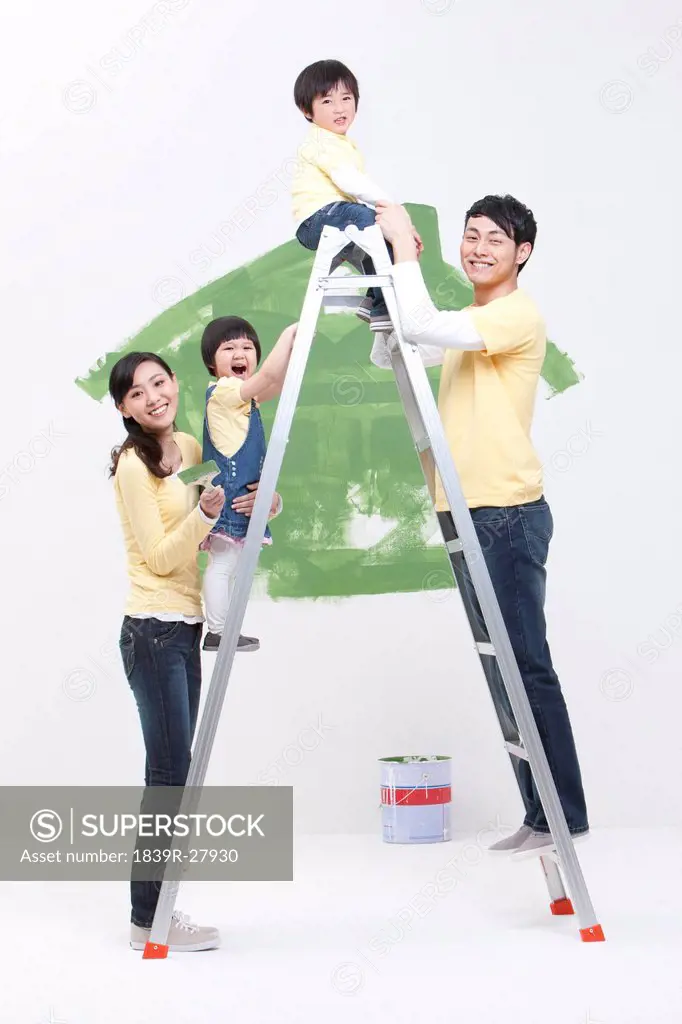 Happy family doing DIY home improvement