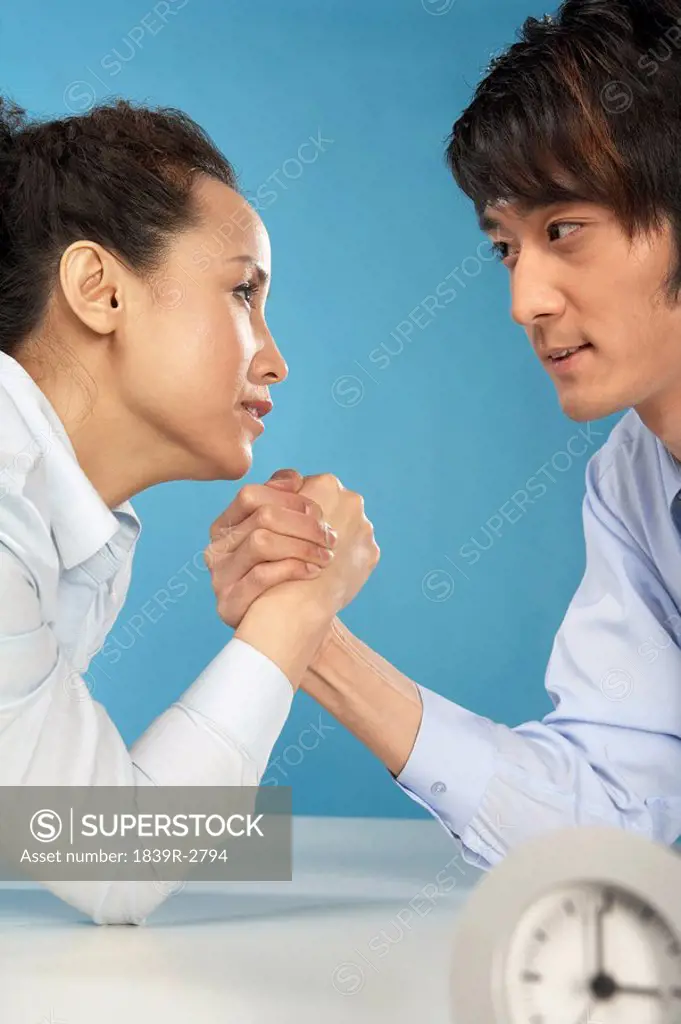 Man And Woman Arm Wrestling