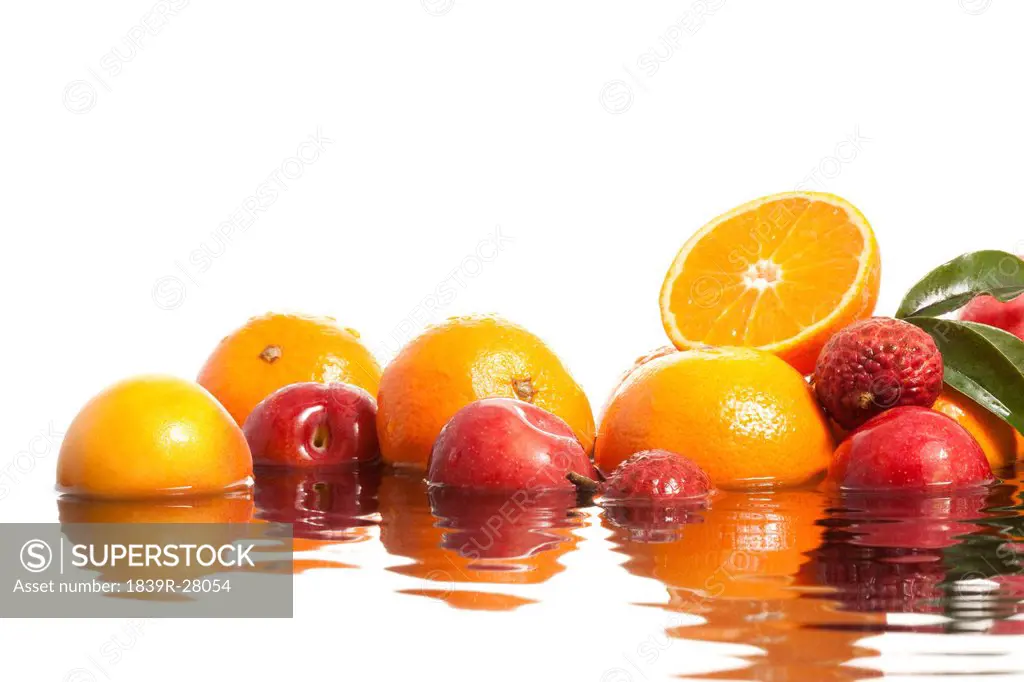 A pile of fruits in rippling water
