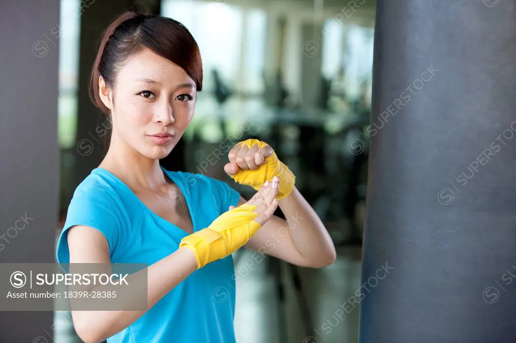 Confident Young Woman in Hand Wraps