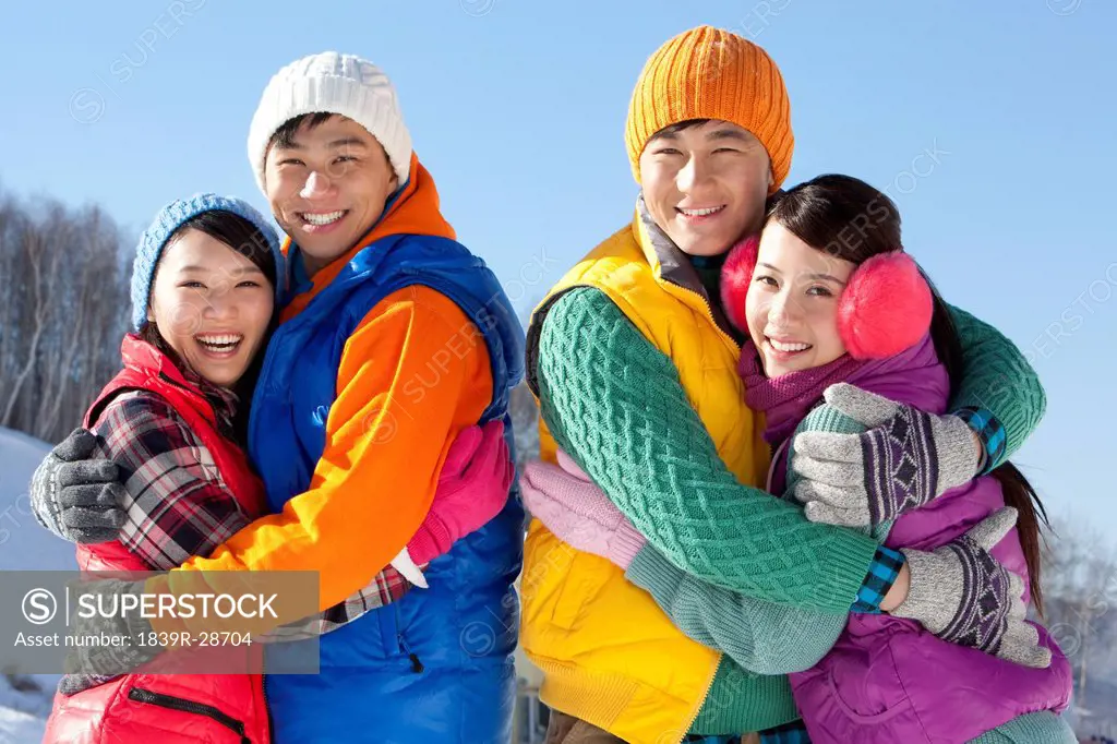 Happy young people in ski resort