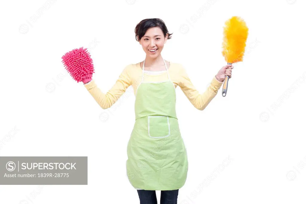 Happy housewife and cleaning products