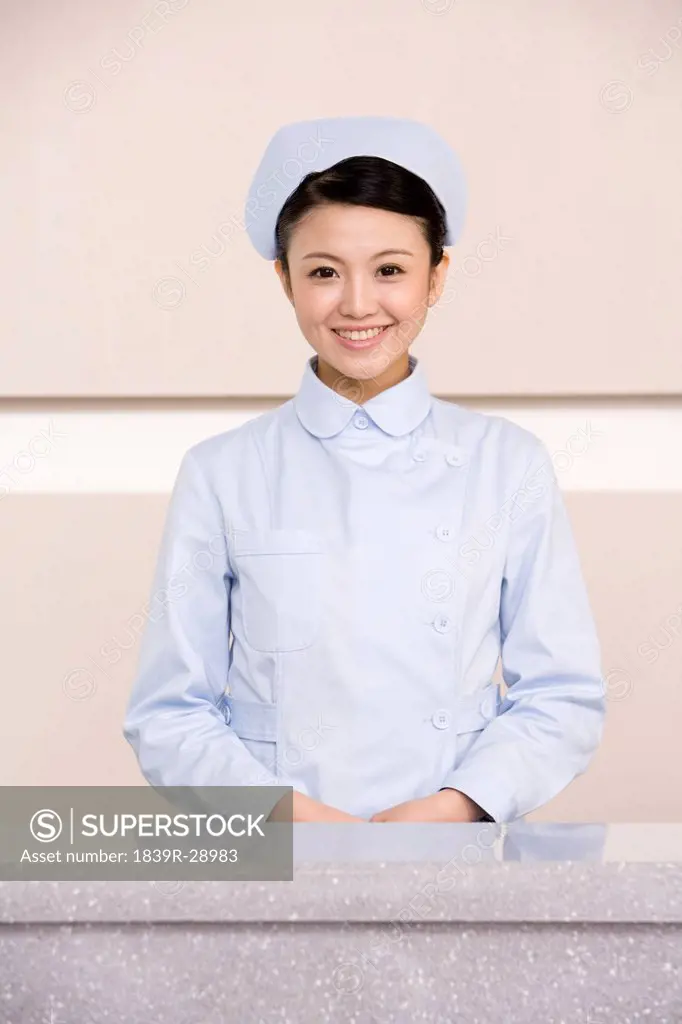 Young Nurse Poised At Nurses´ Station