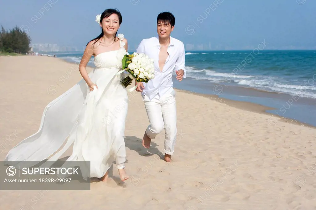 Happy Newlyweds on the Beach