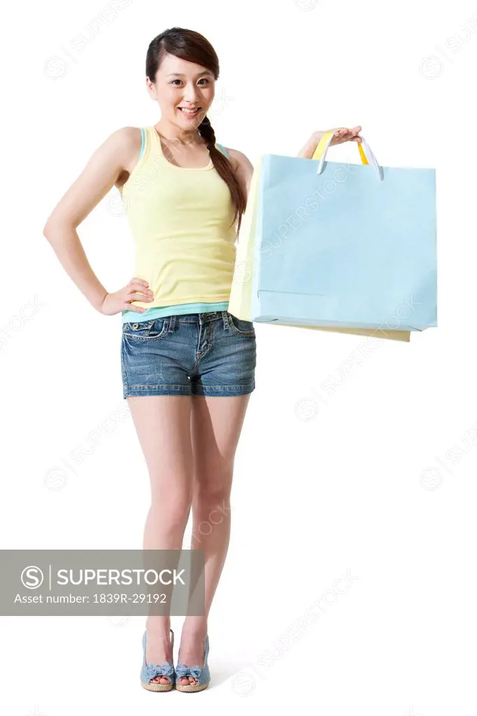 Happy young woman with shopping bags