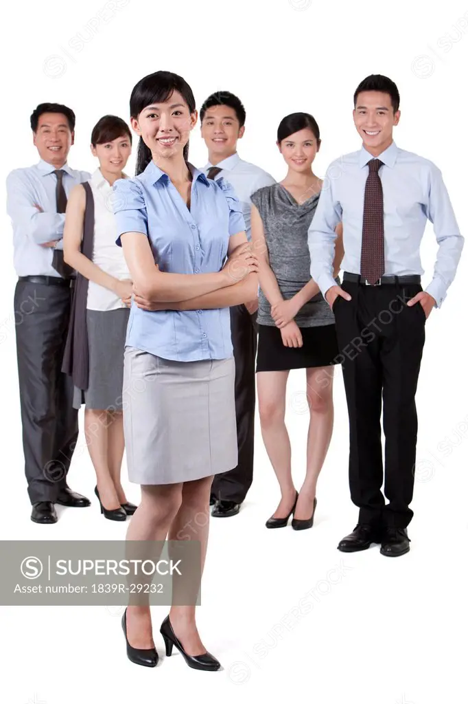 Businesswoman Standing In Front of Colleagues