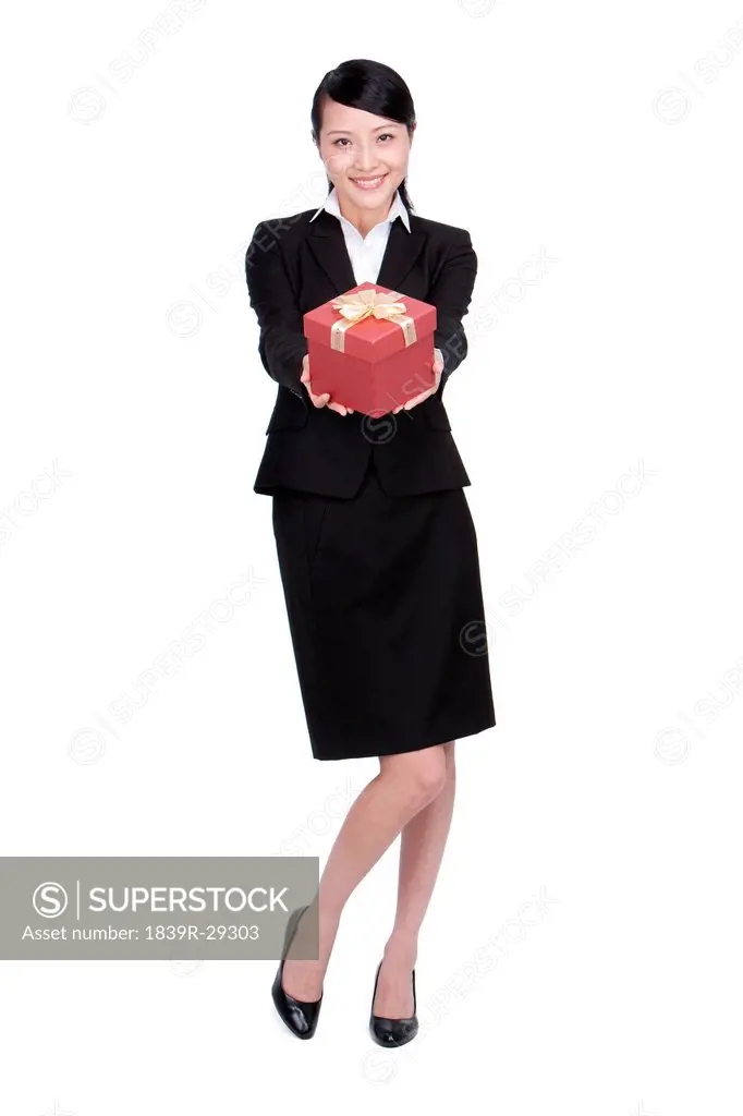 Happy Businesswoman Holding a Gift