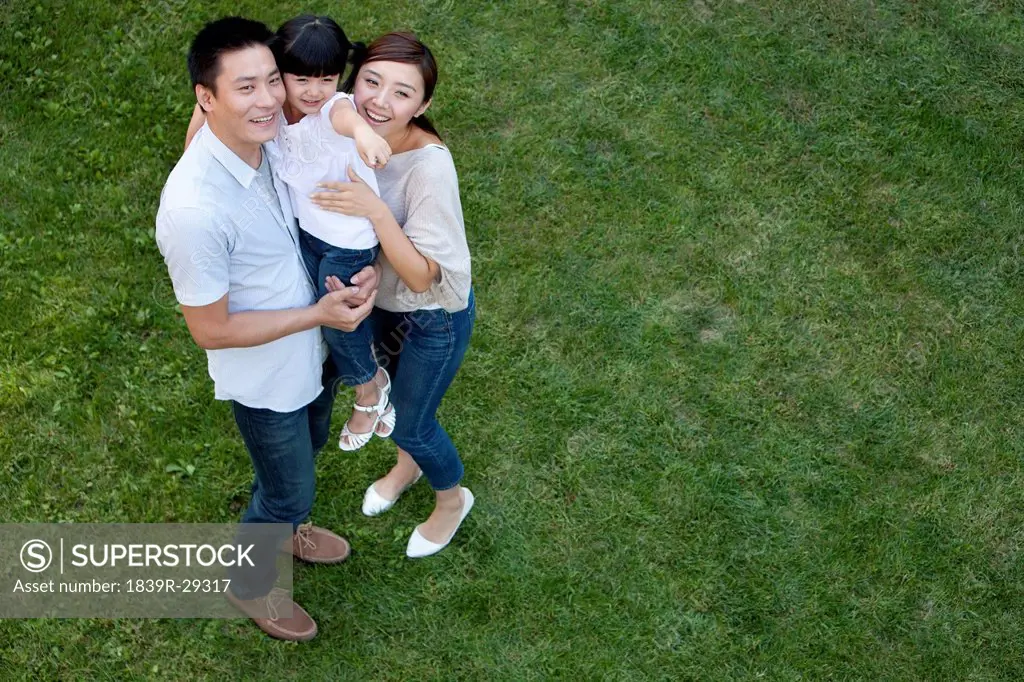 Young Chinese family in a park