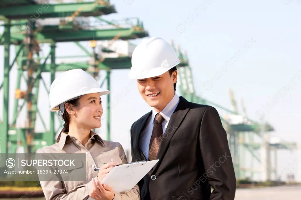 businessman with shipping industry worker