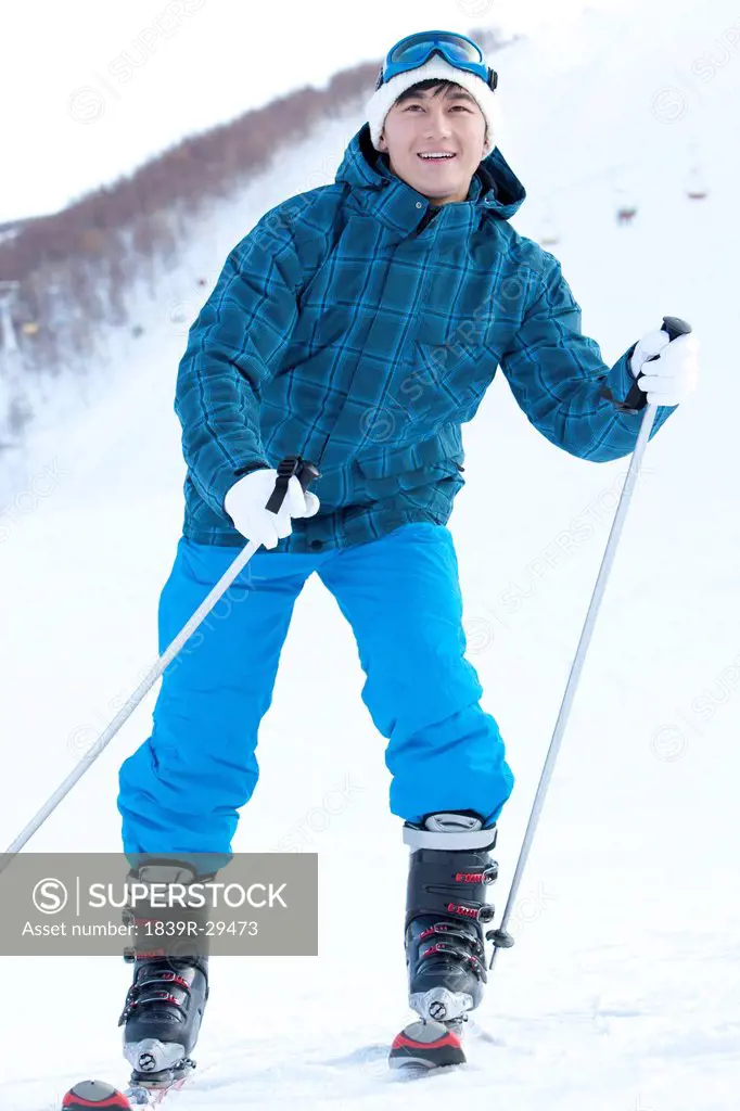 Young man in skiing resort
