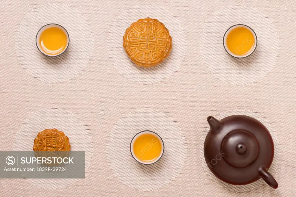 Moon Cakes with Tea on Geometric Place Mat
