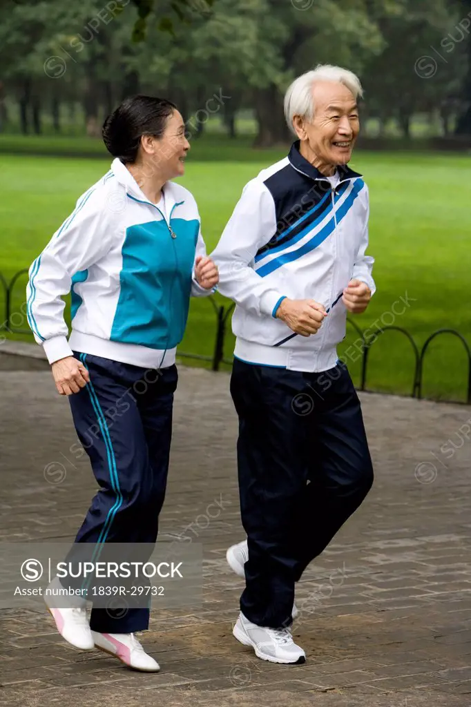 Senior Couple Jogging in a Park