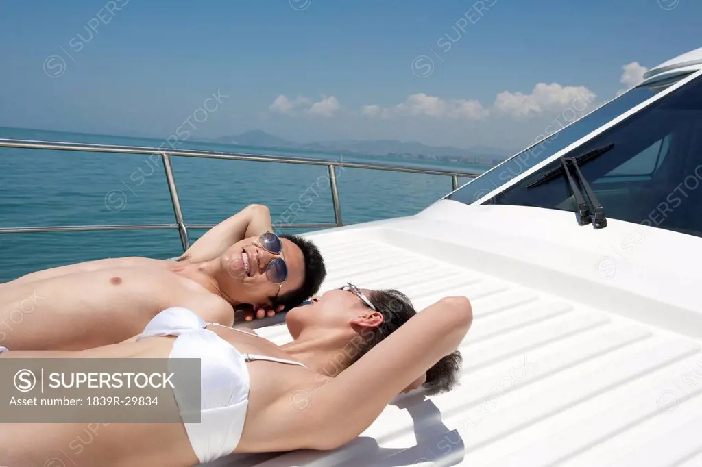 Man and Woman Relaxing on a Yacht