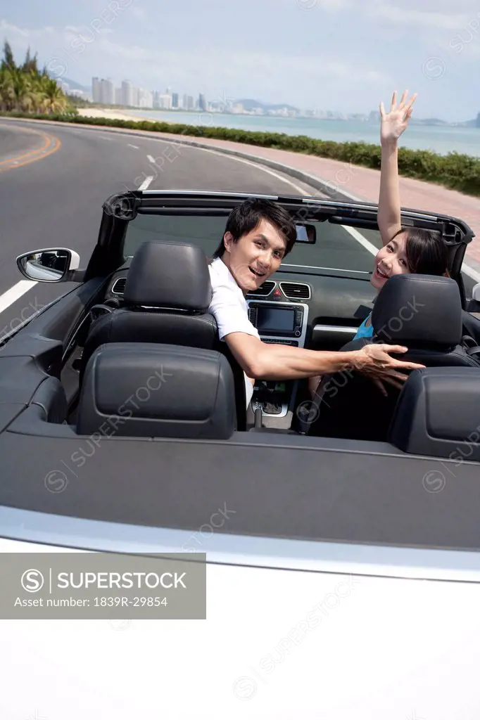 Young People Having Fun in a Convertible