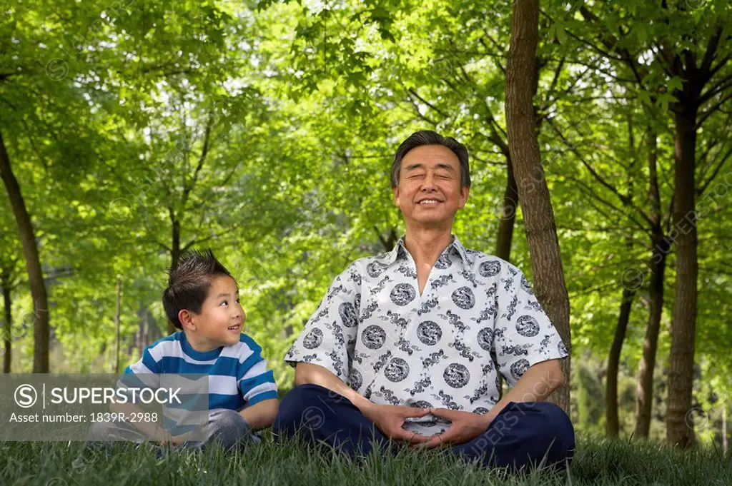 Grandson Watching Grandfather Meditate