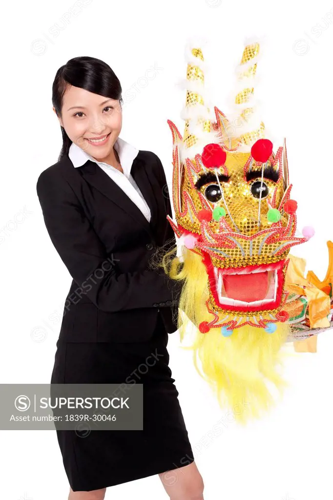Businesswoman practising Chinese dragon dancing