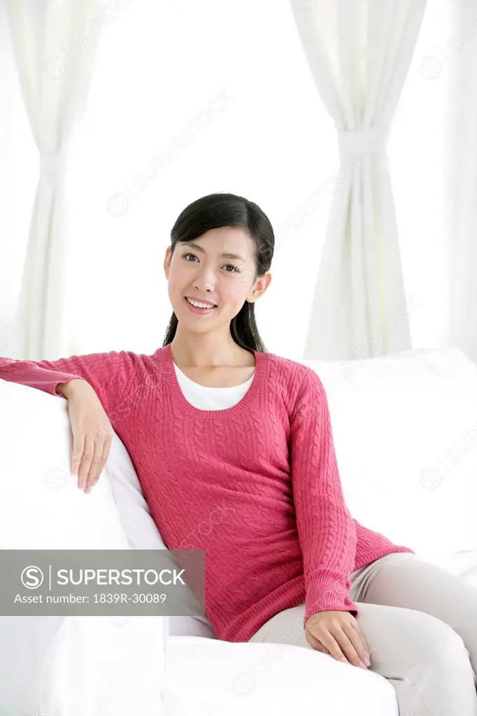 Young Chinese woman in a living room