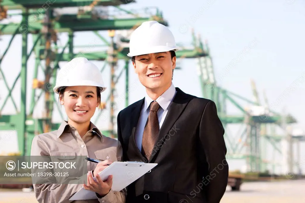 businessman with shipping industry worker