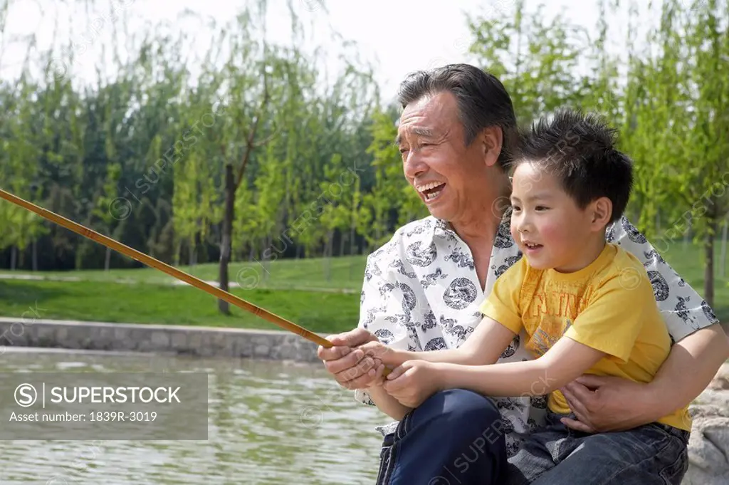 Grandfather Fishing With His Grandson