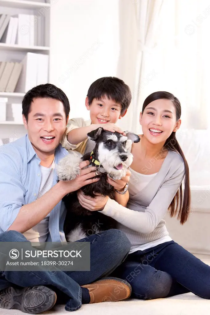 Happy family with pet schnauzer