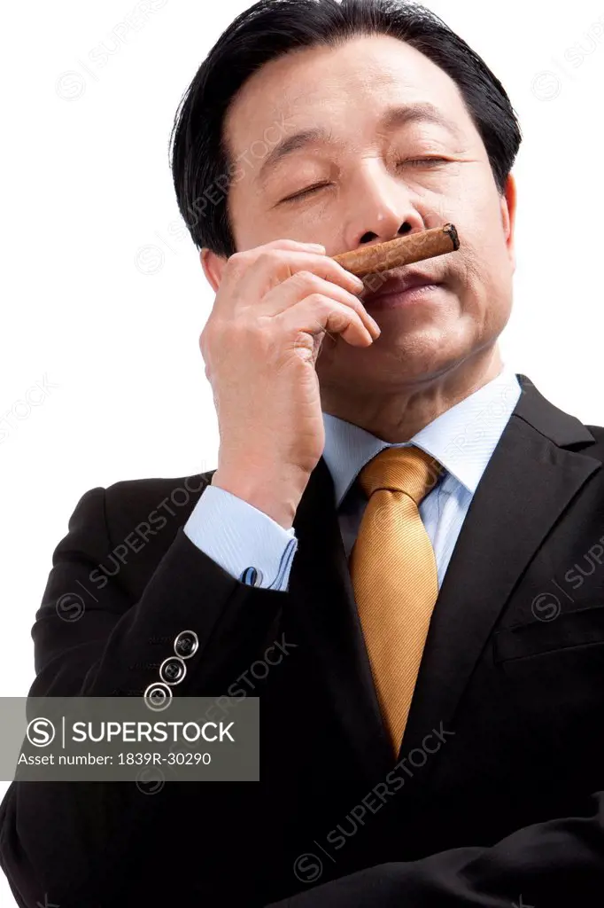 Senior businessman enjoying a cigar