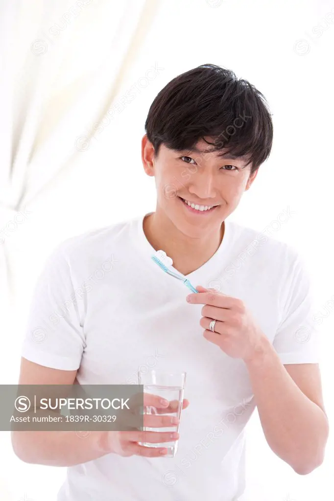 Young man preparing for tooth brush