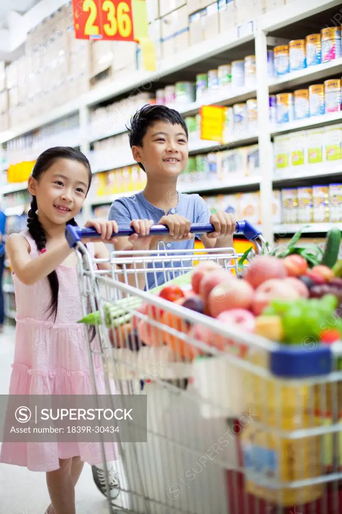 Children shopping in supermarket