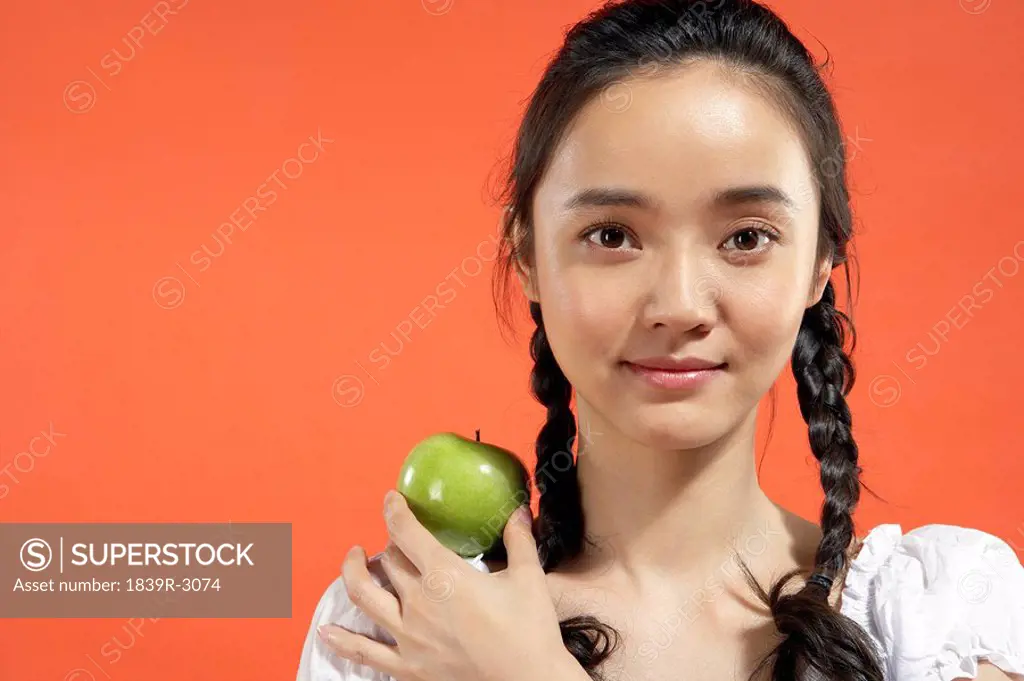 Young Girl With An Apple On Her Shoulder