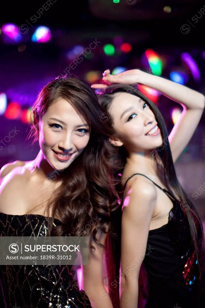 Stylish young women in nightclub