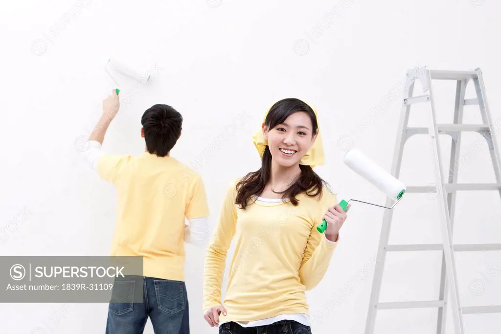 Happy young couple doing DIY home improvement