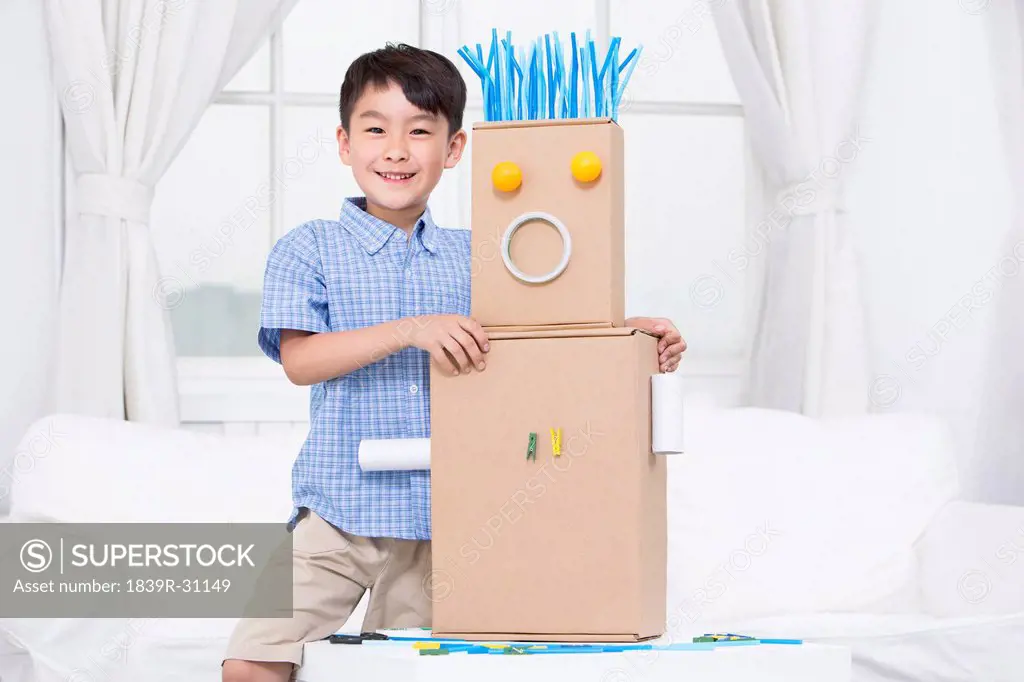 Boy and a handmade toy robot