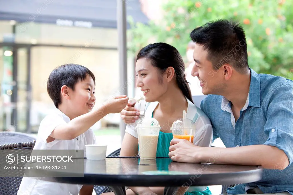 Family enjoying cold drink together