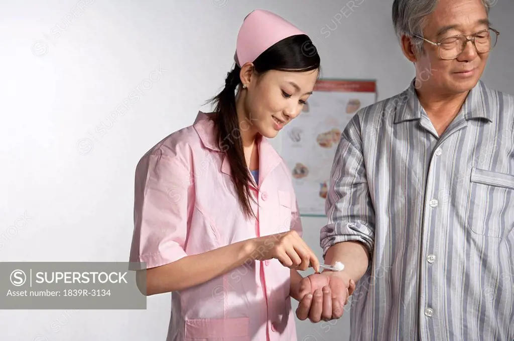 Nurse With A Patient