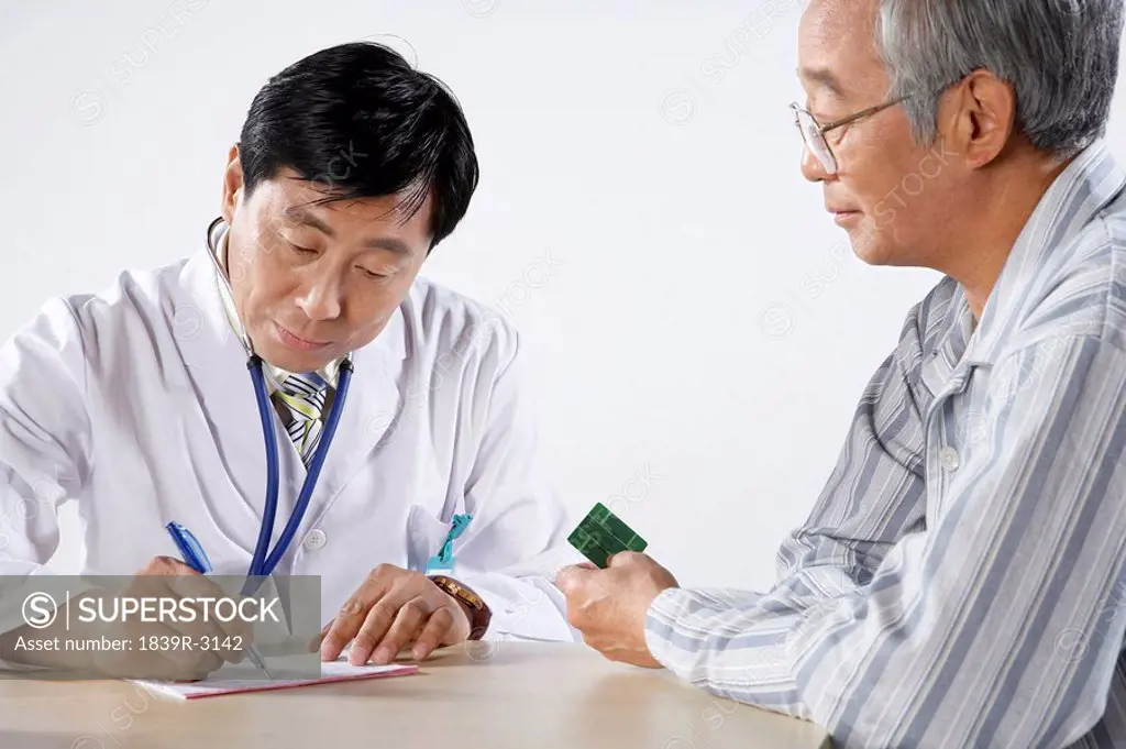 Doctor And Patient In A Consultation