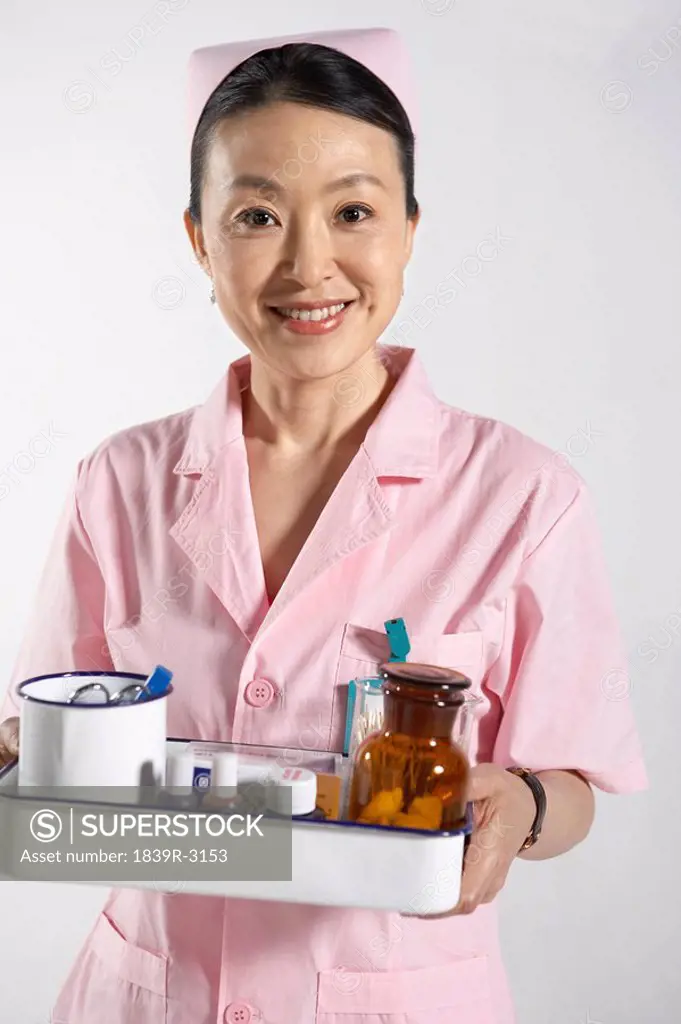 Nurse Holding Medicine Tray