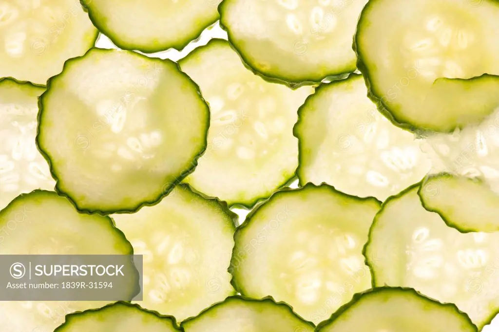 Slices of Cucumbers on White Background