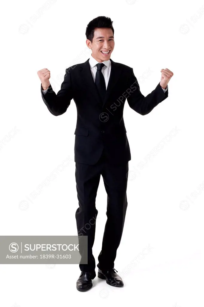 Businessman punching in the air