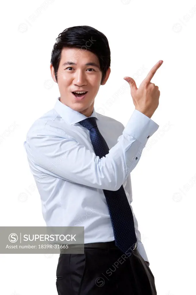 Portrait of an Excited Businessman Pointing