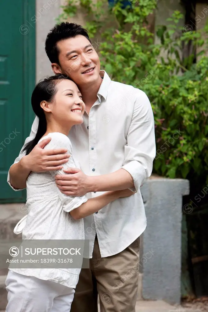 Young Chinese couple embracing