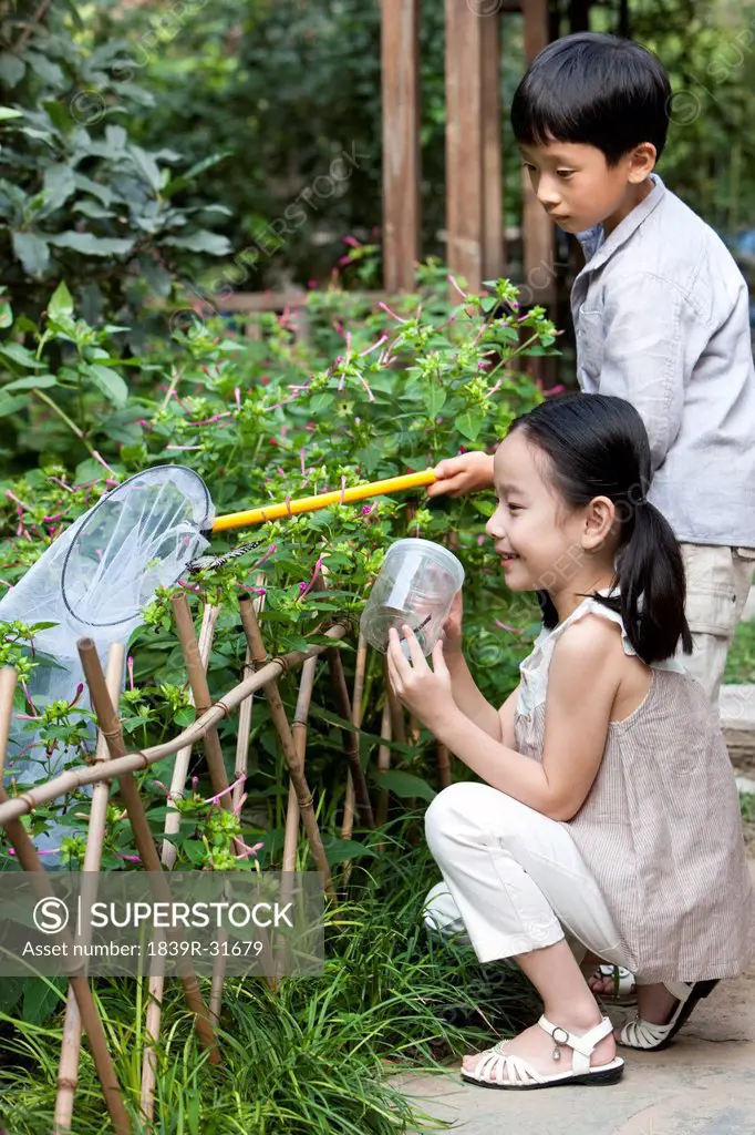 Chinese children playing in a garden