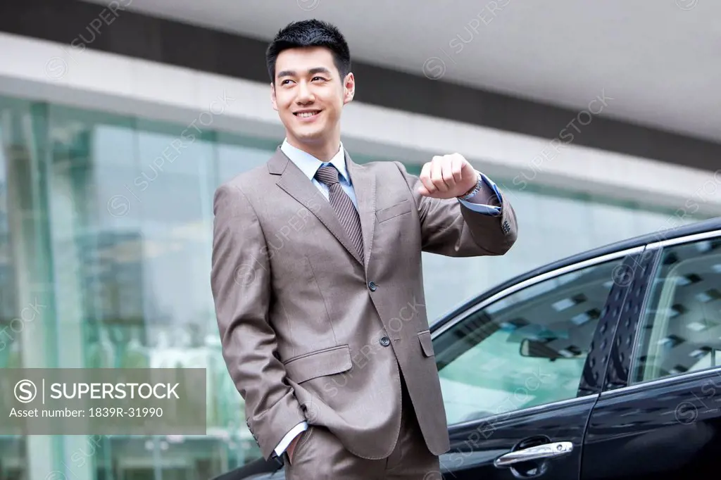Young businessman and car