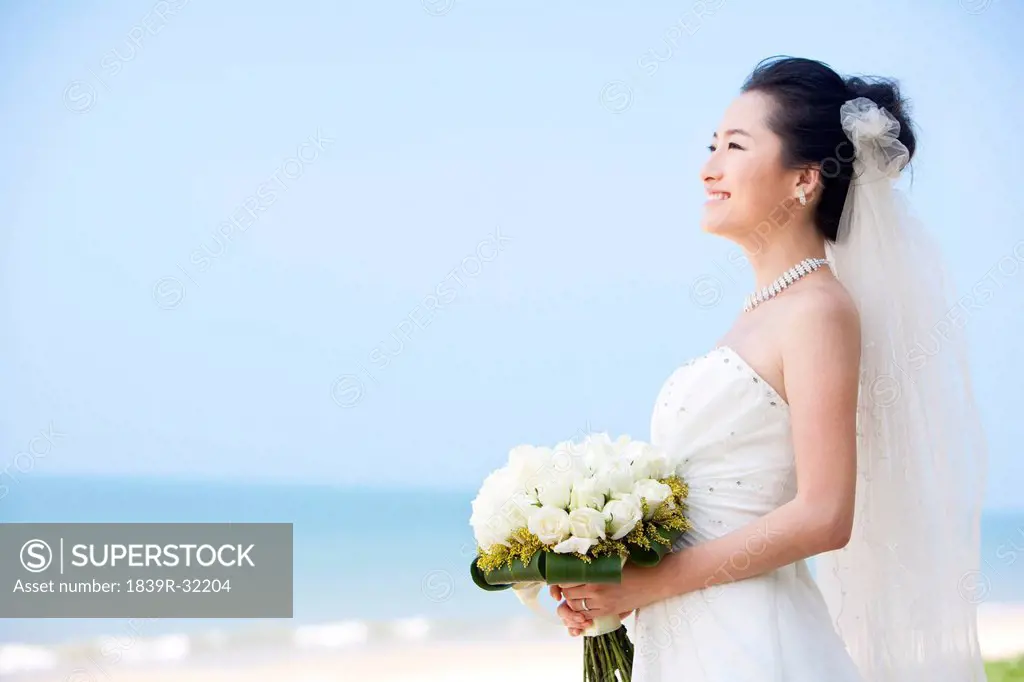 Happy Bride Relaxing on the Beach