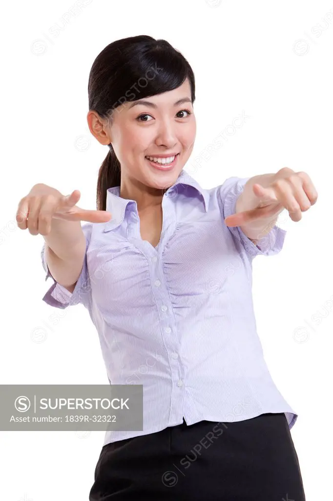 Portrait of a Confident Businesswoman Pointing