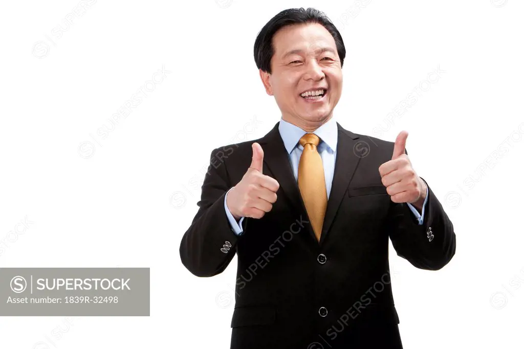 Senior businessman doing thumbs_up