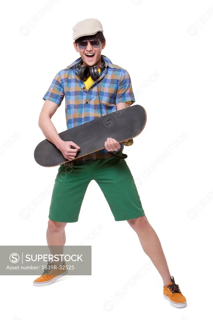 Cool young man with skateboard