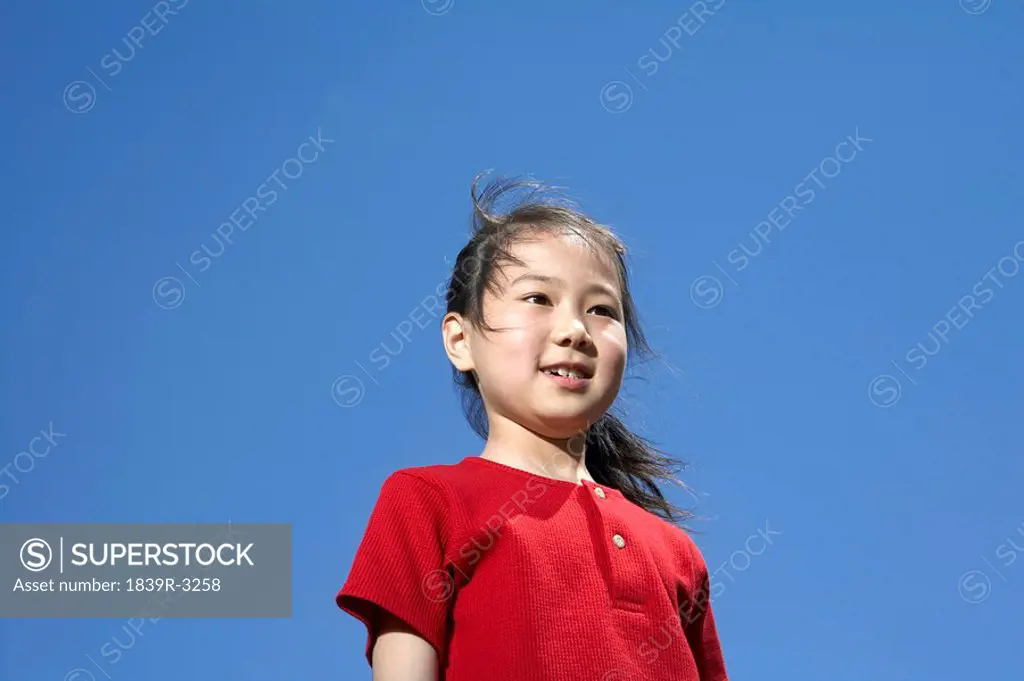 Portrait Of Young Girl Looking Away And Smiling