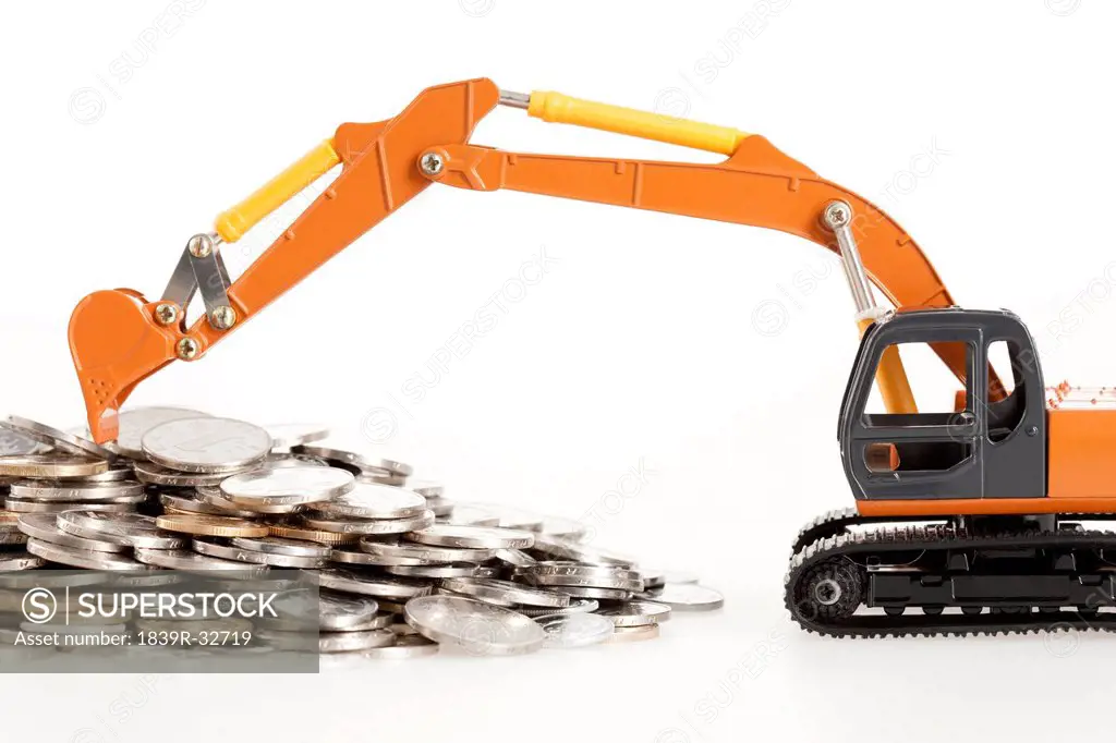 Excavator model and coins